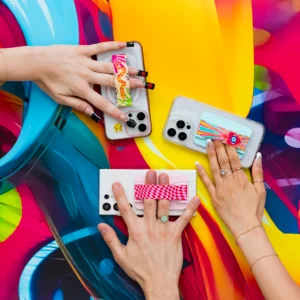 Colorful phone grips on smartphones with vibrant background