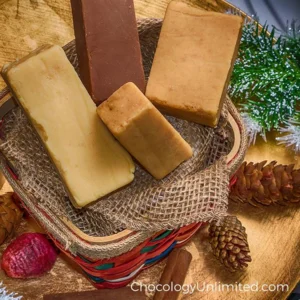 Gourmet fudge assortment in a festive basket with holiday decor.