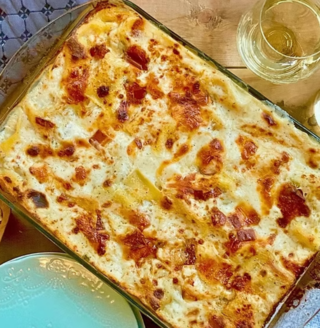 Image showcasing a cheesy recipe from 'The Chef & The Dish,' featuring a delicious and creamy dish, perfect for food lovers and culinary enthusiasts.