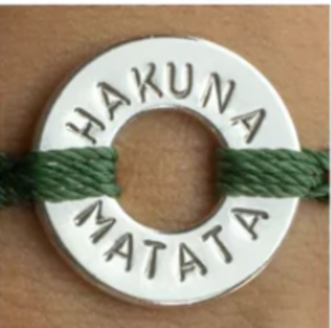 image has a bracelet written "Hakuna Matata " on it