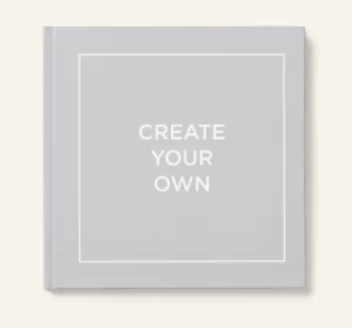 A book with the title 'Create Your Own' on its cover, produced by Groove Book, a company that turns photos into books